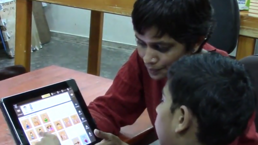 Child and Therapist using Avaz App in therapy